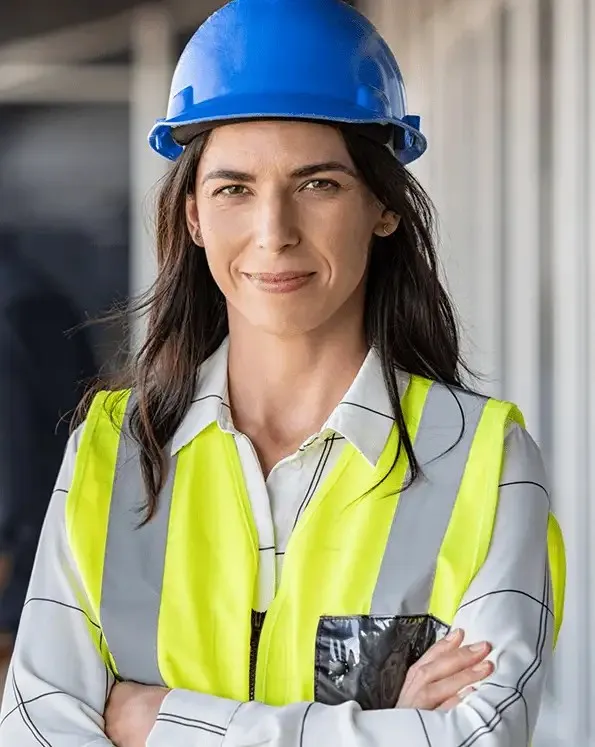 Safety professional in a high-visibility vest and hard hat