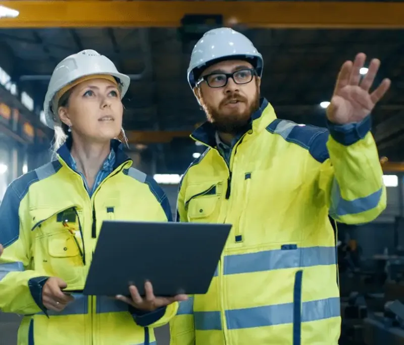Two safety professionals reviewing a plan